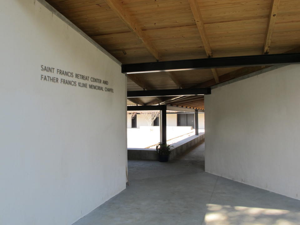 This Oct. 30, 2013, photo shows the entrance to the retreat center at the Mepkin Abbey in Moncks Corner, S.C. The abbey hosts about 1,500 people a year who want to experience the contemplative life. (AP Photo/Bruce Smith)