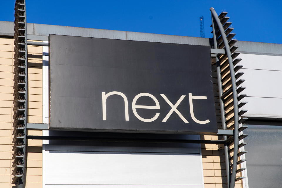 A logo of clothing retailer Next is seen at a store in London, Britain