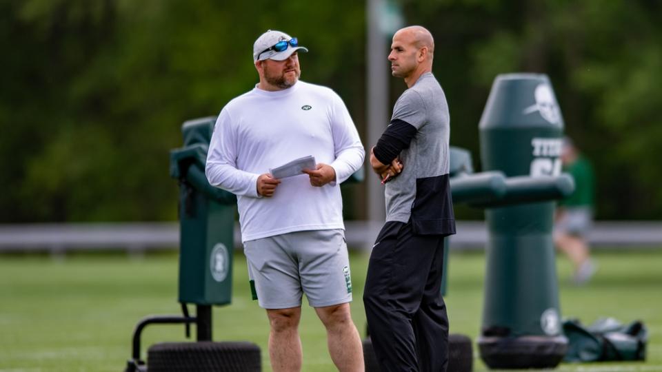 May 27, 2021; Florham Park, NJ, USA; New York Jets general manager Joe Douglas (left) chats with head coach Robert Saleh during an OTA at Jets Atlantic Health Training Center. Mandatory Credit: John Jones-USA TODAY Sports