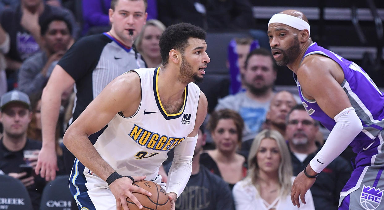 Jamal Murray and Vince Carter battle during a regular season game between the Denver Nuggets and Sacramento Kings in 2018. (Photo by Thearon W. Henderson/Getty Images)