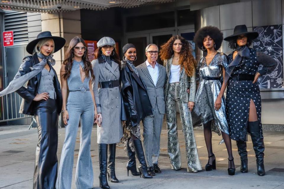 Tommy Hilfiger and Zendaya are flanked by models including Winnie Harlow, Halima Aden and Ebonee Davis outside the Apollo.