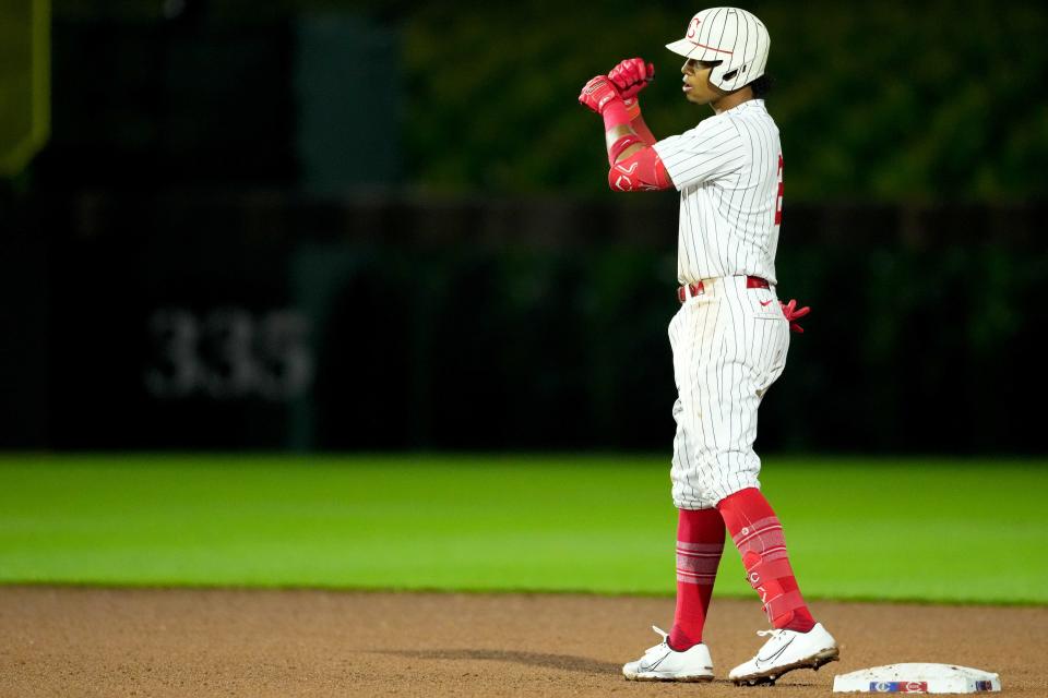 Cincinnati Reds shortstop Jose Barrero (2) celebrates a double at second base during the seventh inning of a baseball game against the Chicago Cubs, Thursday, Aug. 11, 2022, at the MLB Field of Dreams stadium in Dyersville, Iowa. 