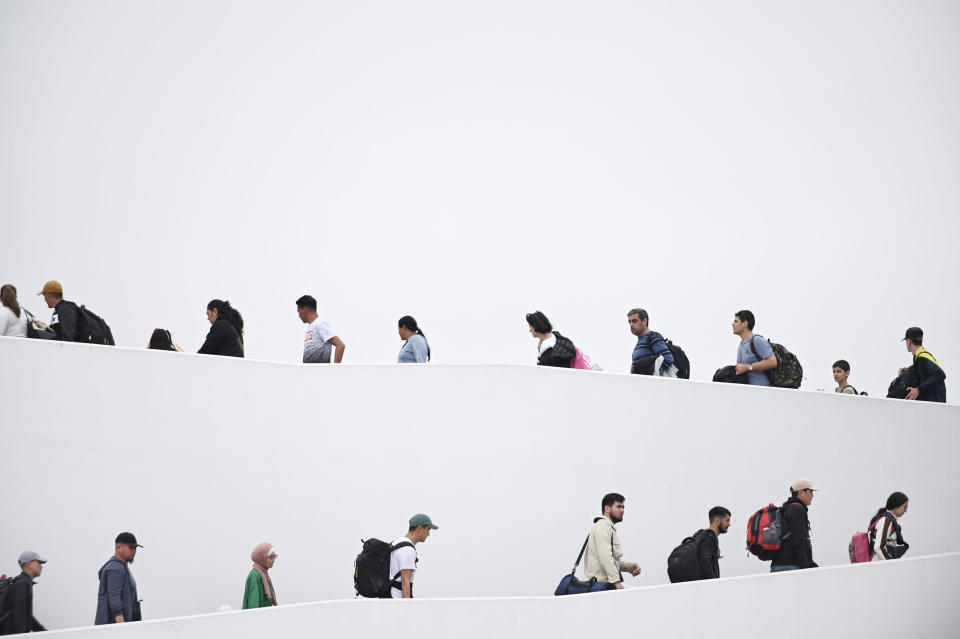 Migrants with CBP One app interviews are allowed to enter the United States at the Chaparral pedestrian border in Tijuana, Mexico, on May 16, 2023.<span class="copyright">Carlos A. Moreno—Anadolu Agency/Getty Images</span>