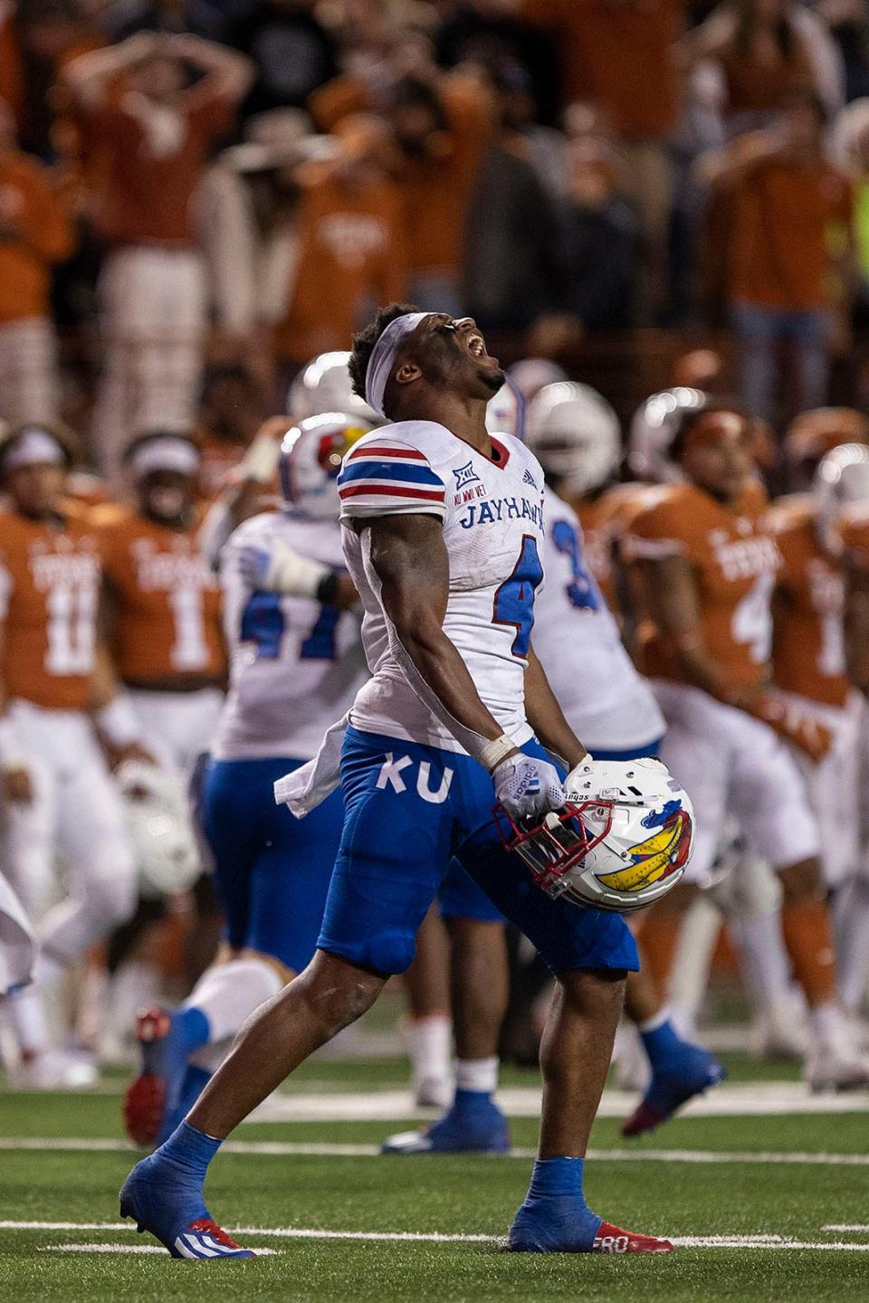 Kansas football running back Devin Neal (4) reacts after the Jayhawks won a game against the Texas Longhorns in overtime on Nov. 13, 2021. Neal was a freshman that season at Kansas.