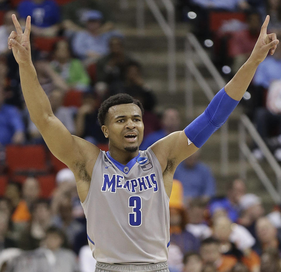 Memphis guard Chris Crawford (3) reacts to a Mercer goal against George Washington during the second half of an NCAA college basketball second-round tournament game, Friday, March 21, 2014, in Raleigh. Memphis won 71-66. (AP Photo/Gerry Broome)