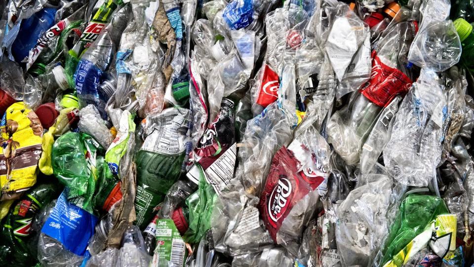 Crushed plastic bottles sit in a bale following sorting at the Mid-America Recycling plant, in Lincoln, Neb., in 2016.