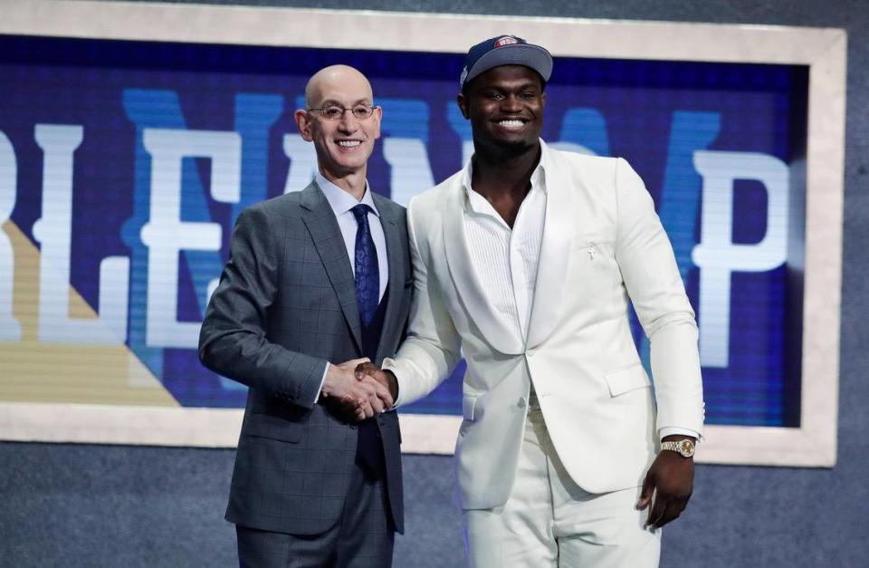 Duke’s Zion Williamson, right, poses for photographs with NBA Commissioner Adam Silver after being selected by the New Orleans Pelicans as the first pick during the NBA basketball draft Thursday, June 20, 2019, in New York. (AP Photo/Julio Cortez)