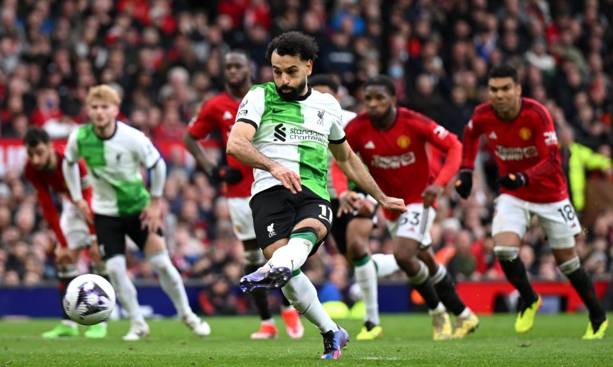 <span>Mohamed Salah strokes home the equalising penalty late on in a topsy-turvy afternoon at Old Trafford.</span><span>Photograph: Michael Regan/Getty Images</span>