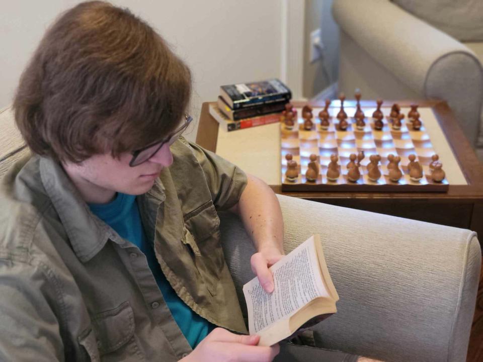 Sixteen-year-old author Brandon Dowty enjoys one of many hobbies during his down time at his home in Hardin Valley. He is a voracious reader and is interested in many things, including sci-fi and history.