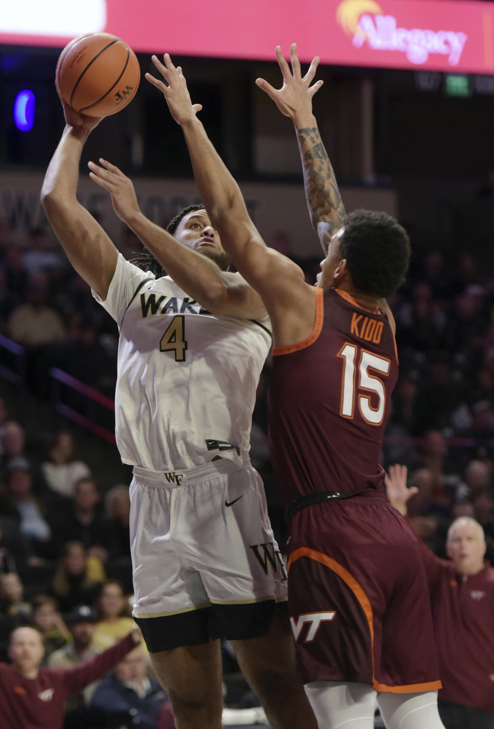 Wake Forest's Efton Reid III sinks a basket over Virginia Tech's Lynn Kidd during an NCAA college basketball game, Saturday, Dec. 30, 2023 in Winston-Salem, N.C. (Walt Unks/The Winston-Salem Journal via AP)