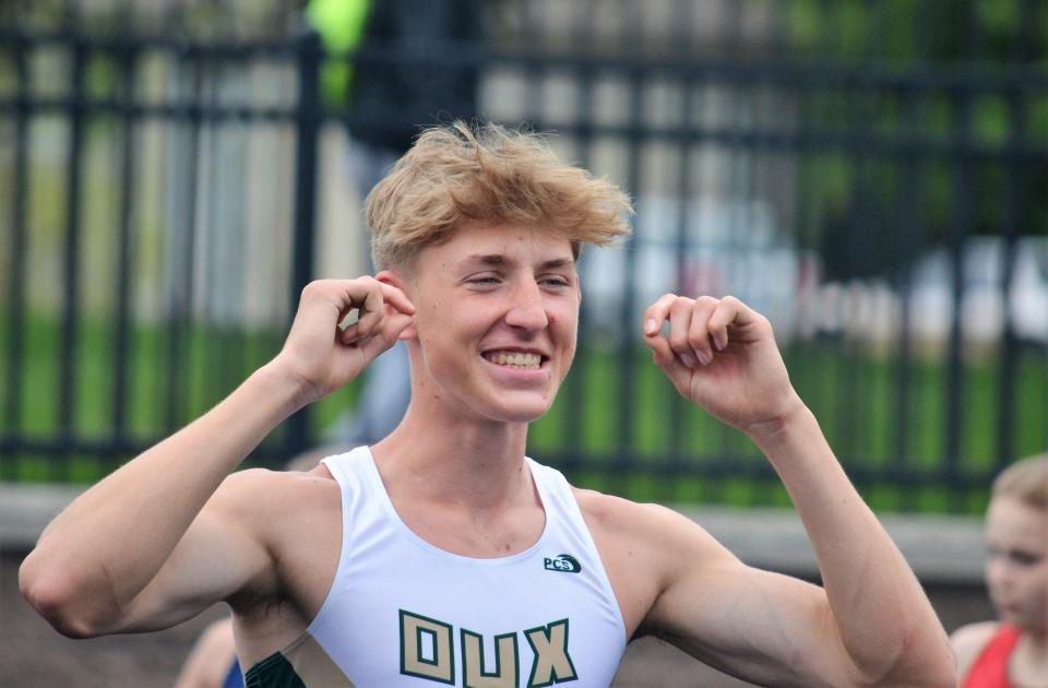Zeeland West's Andrew Kraft celebrates breaking the school record in the high jump at the OK Green Conference meet on Friday, May 12, 2023, at Zeeland Stadium.