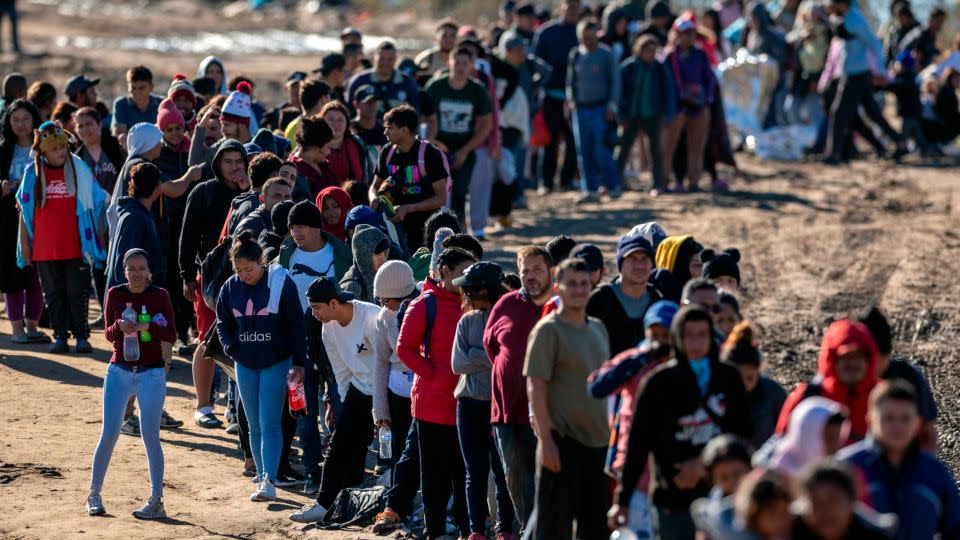 More than 1,000 migrants wait in line to be processed by U.S. Border Patrol agents after crossing the Rio Grande from Mexico on December 18, 2023 in Eagle Pass, Texas. - John Moore/Getty Images