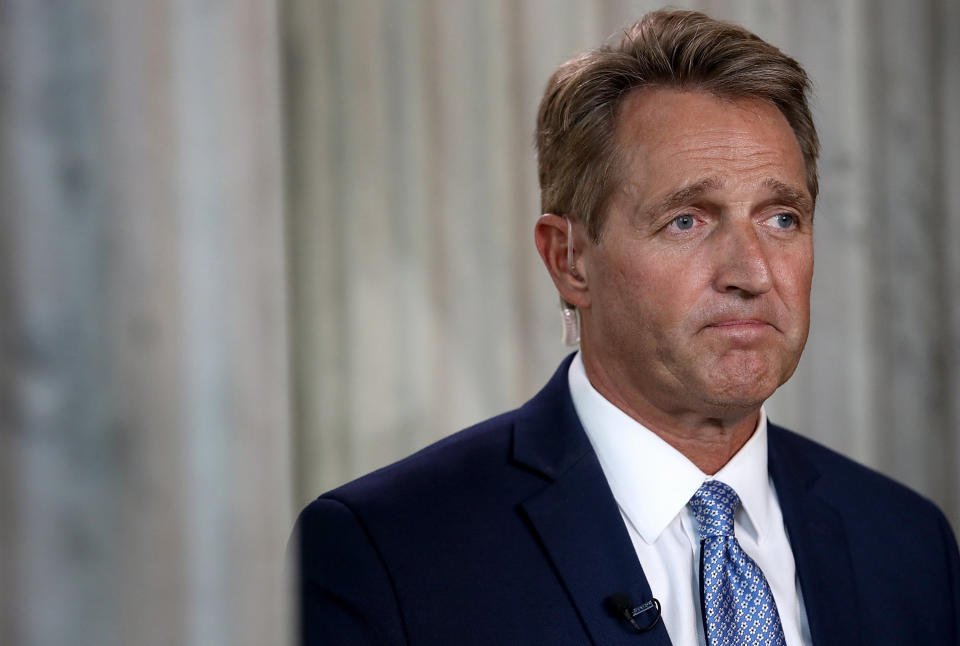 Sen. Jeff Flake (R-Ariz.) looking sad, after he&nbsp;announced he's not&nbsp;running for re-election. He said he's bowing out because he can no longer be "complicit" with what President Donald Trump is doing to the country. (Photo: Win McNamee via Getty Images)