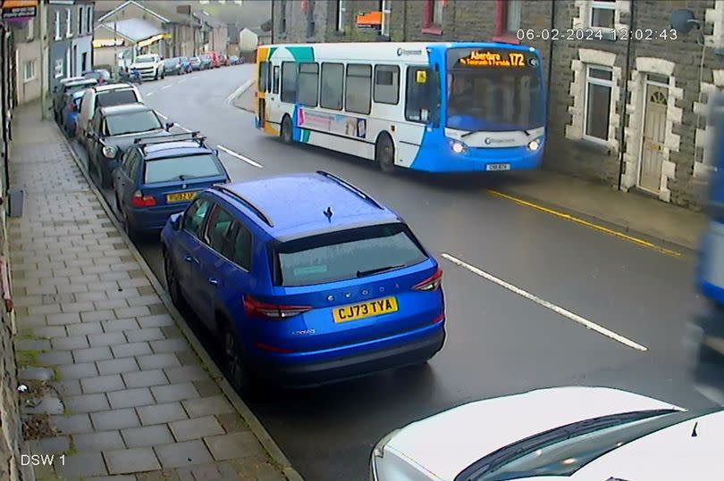 A bus appears to drive onto the sidewalk on February 6, 2024