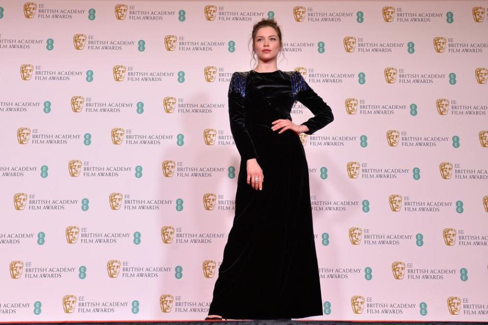 Sophie Cookson in a classic black dress.