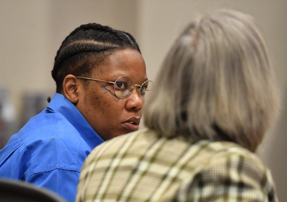LaToya Johnson speaks to her attorney, Liane McCurry on Wednesday in court. Johnson is standing trial for the murder of Alain Sierra at Patellini's Pizza on Main St. in downtown Sarasota on New Year's Day 2022. She is also charged with being a convicted felon in possession of a firearm and carrying a concealed weapon.