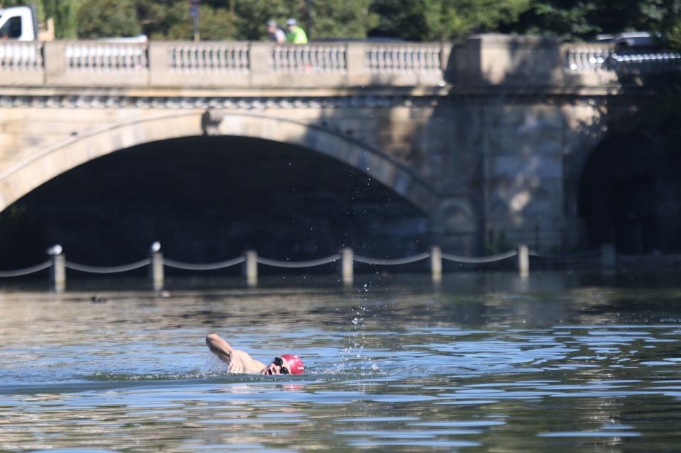 A man takes a morning swim in Hyde Park (PA)