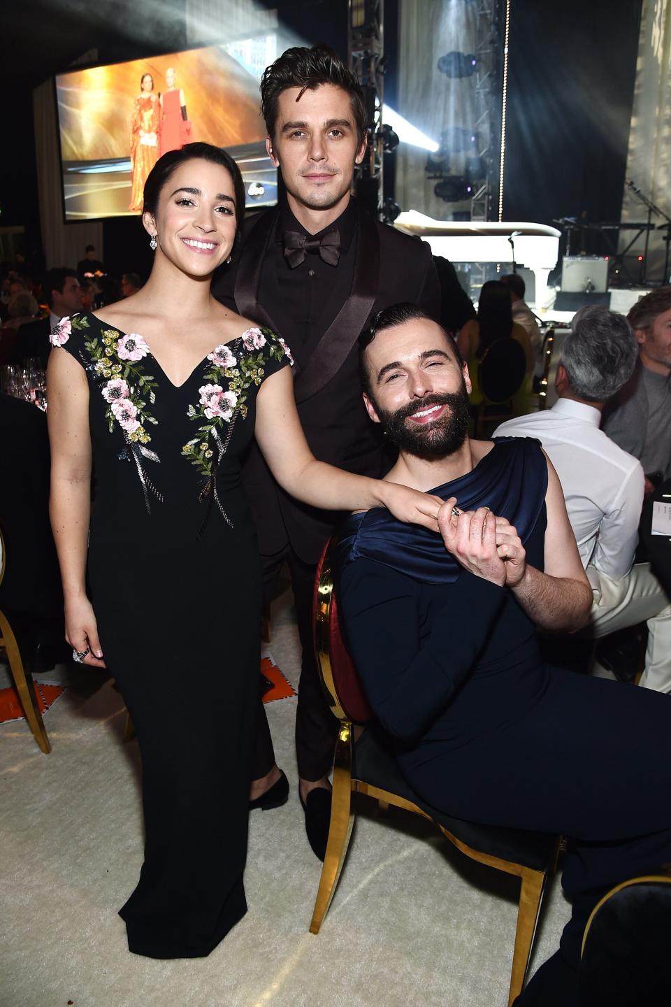 Olympic gymnast Aly Raisman catches up with <em>Queer Eye</em>'s Antoni Porowski and Jonathan Van Ness the Elton John AIDS Foundation Academy Awards Viewing Party. 