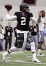 Texas A&M quarterback Johnny Manziel passes the ball during a drill at pro day for NFL football representatives in College Station, Texas, Thursday, March 27, 2014. (AP Photo/Patric Schneider)