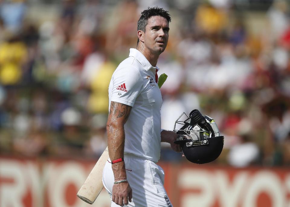 FILE- England's Kevin Pietersen walks back to the pavilion on the fourth day of their Ashes cricket Test match against Australia, in Perth, Australia, in this file photo dated Monday, Dec. 16, 2013. Pietersen's England career appears to be over, it is announced Tuesday Feb. 4, 2013, after the brash batsman was not selected for the upcoming tour of West Indies. Pietersen has attracted controversy during his playing career and accused of being a divisive influence within the England team, but he went on to play 104 Test matches, 136 one-day games and 37 Twenty20 fixtures for England. (AP Photo/Theron Kirkman, FILE)