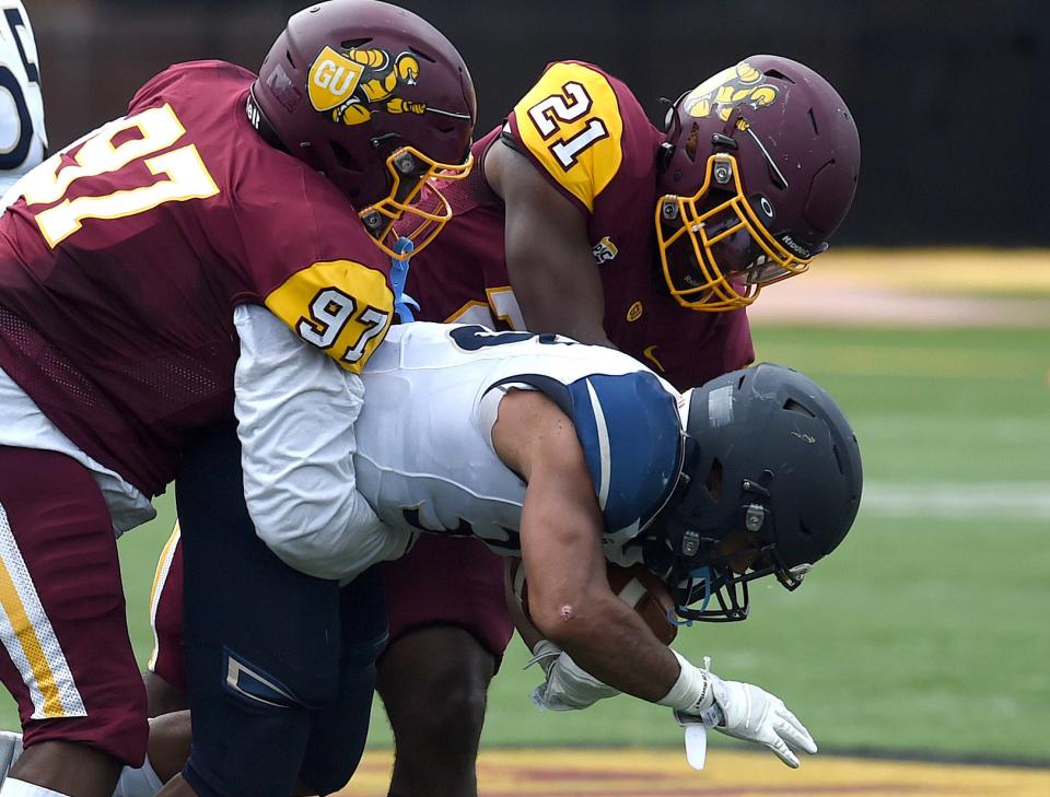 Malachi Woody, left, had five tackles for loss and 3½ sacks for Gannon in 2021 while teammate Nigel Reddick, right, had 54 tackles including four for loss.