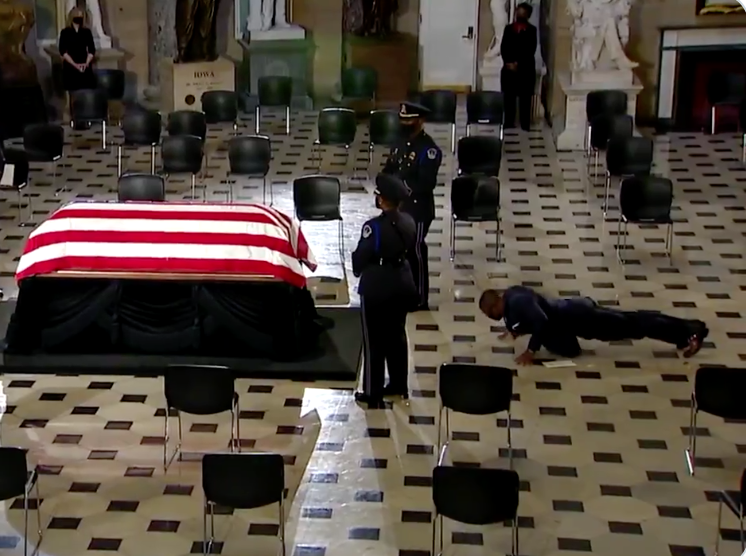 Ruth Bader Ginsburg's personal trainer does push-ups in front of her casket (C-Span)