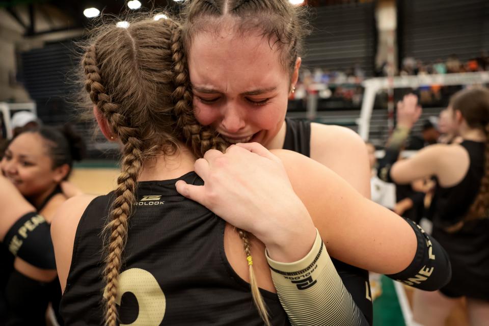 Lone Peak’s Ava Burgess, Zoey Burgess and teammates celebrate their win over Skyridge in the 6A girls volleyball state championship at the UCCU Center in Orem on Saturday, Nov. 4, 2023. | Spenser Heaps, Deseret News
