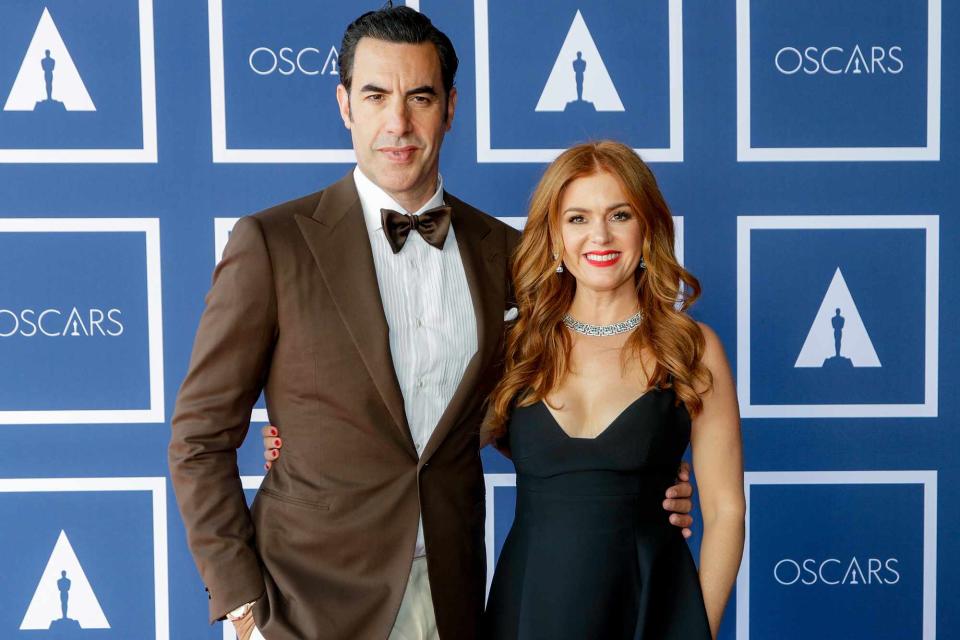 <p>Rick Rycroft-Pool/Getty</p> Sacha Baron Cohen (L) and Isla Fisher