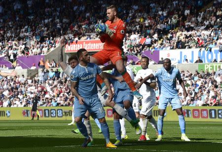 Britain Soccer Football - Swansea City v Stoke City - Premier League - Liberty Stadium - 22/4/17 Stoke City's Jack Butland jumps to catch the ball Reuters / Rebecca Naden Livepic