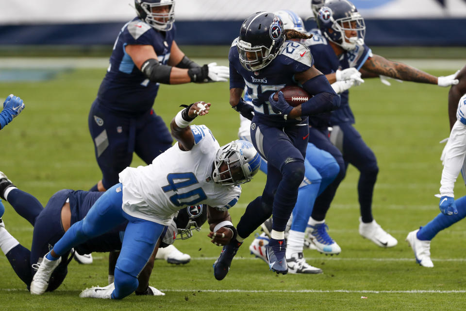 Tennessee Titans running back Derrick Henry (22) breaks away from Detroit Lions middle linebacker Jarrad Davis during the first half of an NFL football game Sunday, Dec. 20, 2020, in Nashville, N.C. (AP Photo/Wade Payne)