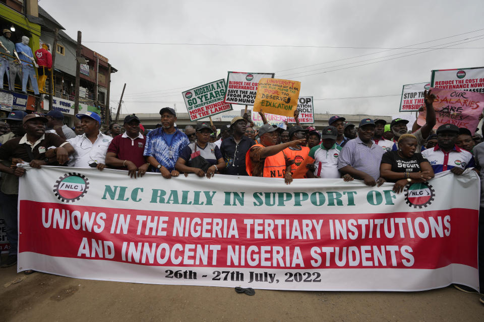 FILE - Nigeria Labour union protest in solidarity with the Academic Staff Union of Universities, on the street in Lagos, Nigeria, on July 26, 2022. A strike declared by lecturers in Nigerian public universities has now clocked six months, hurting an estimated 2.5 million students who do not have other means of learning. Such strikes are common in this West African nation with more than 100 public universities. (AP Photo/Sunday Alamba, File)