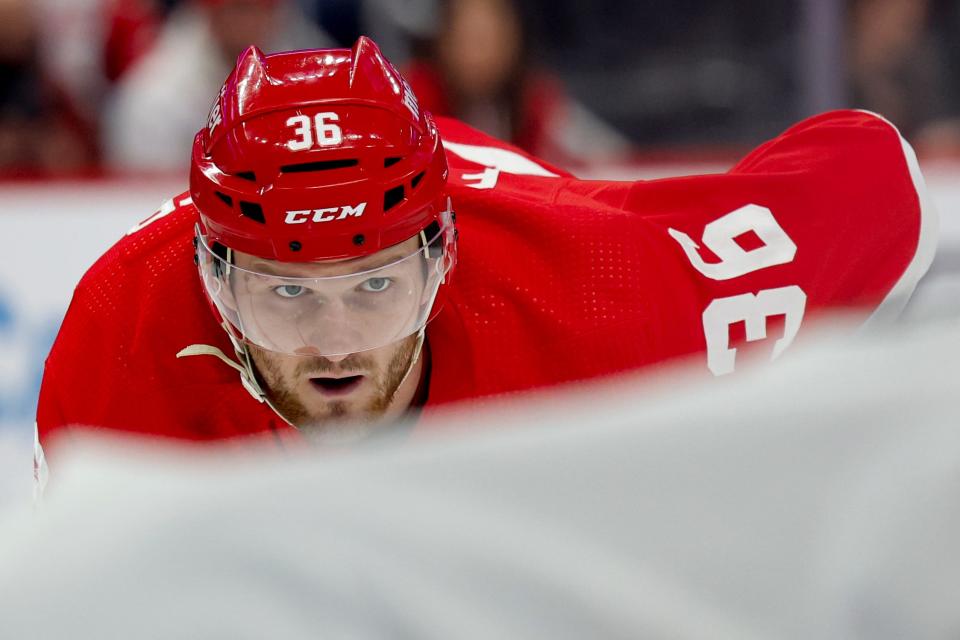 Red Wings right wing Christian Fischer gets set during a faceoff in the second period of the Wings' 3-2 overtime loss to the Senators on Wednesday, Jan. 31, 2024, at Little Caesars Arena.