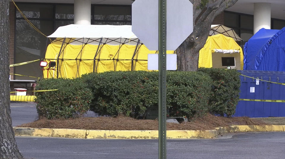 This Friday, March 13, 2020 photo shows tents set up outside the Lexington Medical Center hospital in West Columbia, S.C. U.S. hospitals are setting up tents for testing, canceling elective surgeries, calling on retired doctors for help and confronting the possibility they will have to ration treatment as they prepare for an expected onslaught of coronavirus patients. (AP Photo/Sarah Blake Morgan)