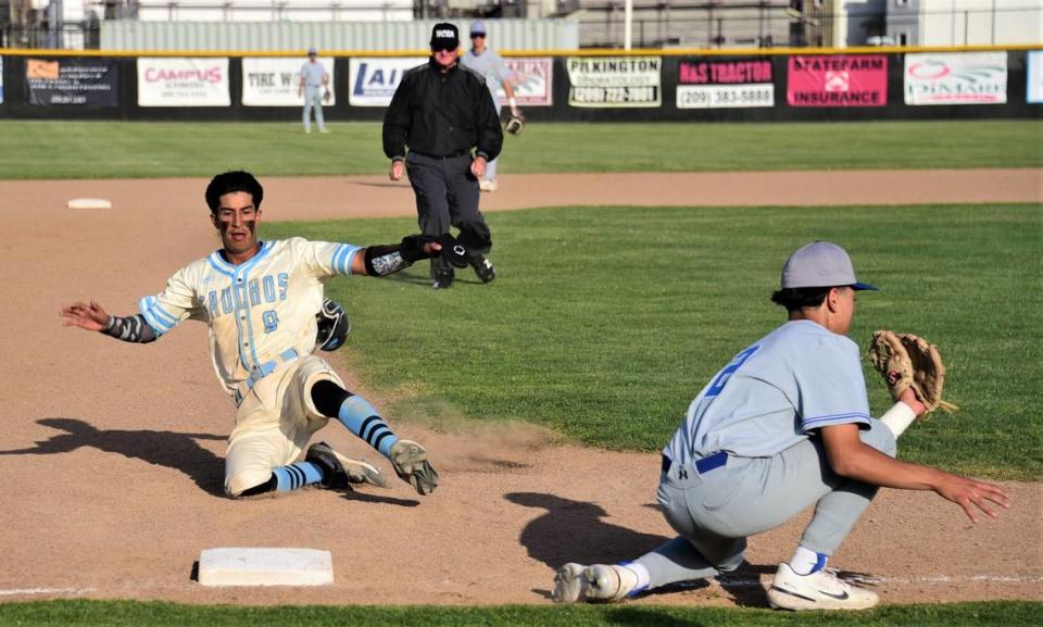 El Capitan High School sophomore Braylen Centeno steals third base during a playoff game against Bear Creek on Tuesday, May 9, 2023 at El Capitan High School.