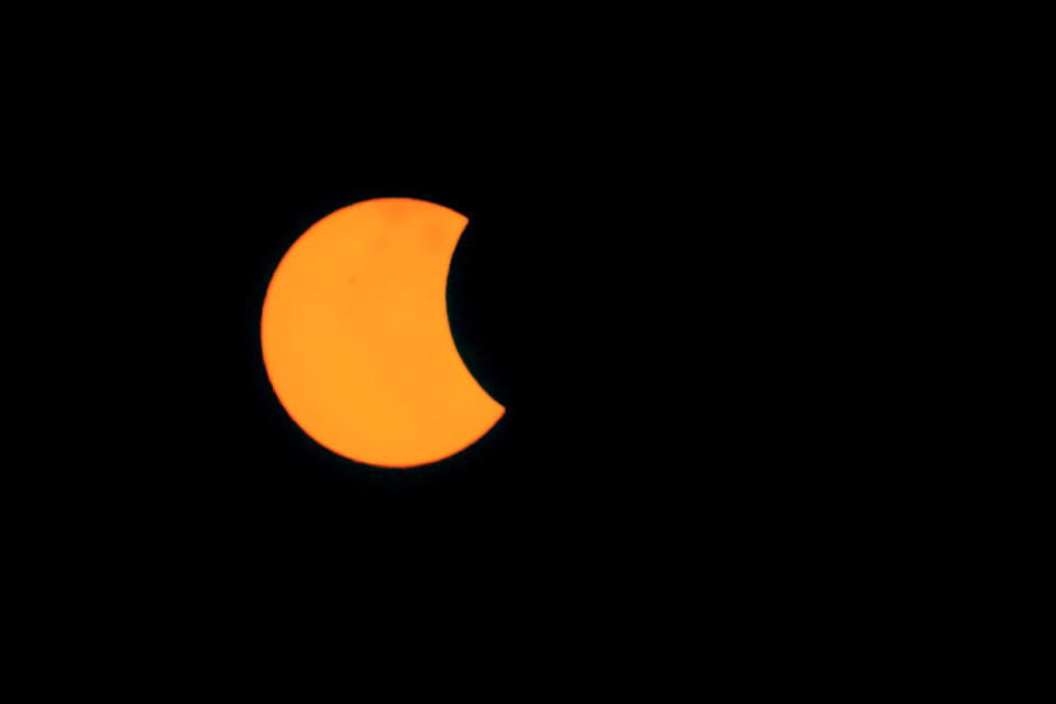 A partial hybrid solar eclipse is seen in Palembang, Indonesia on April 20, 2023.