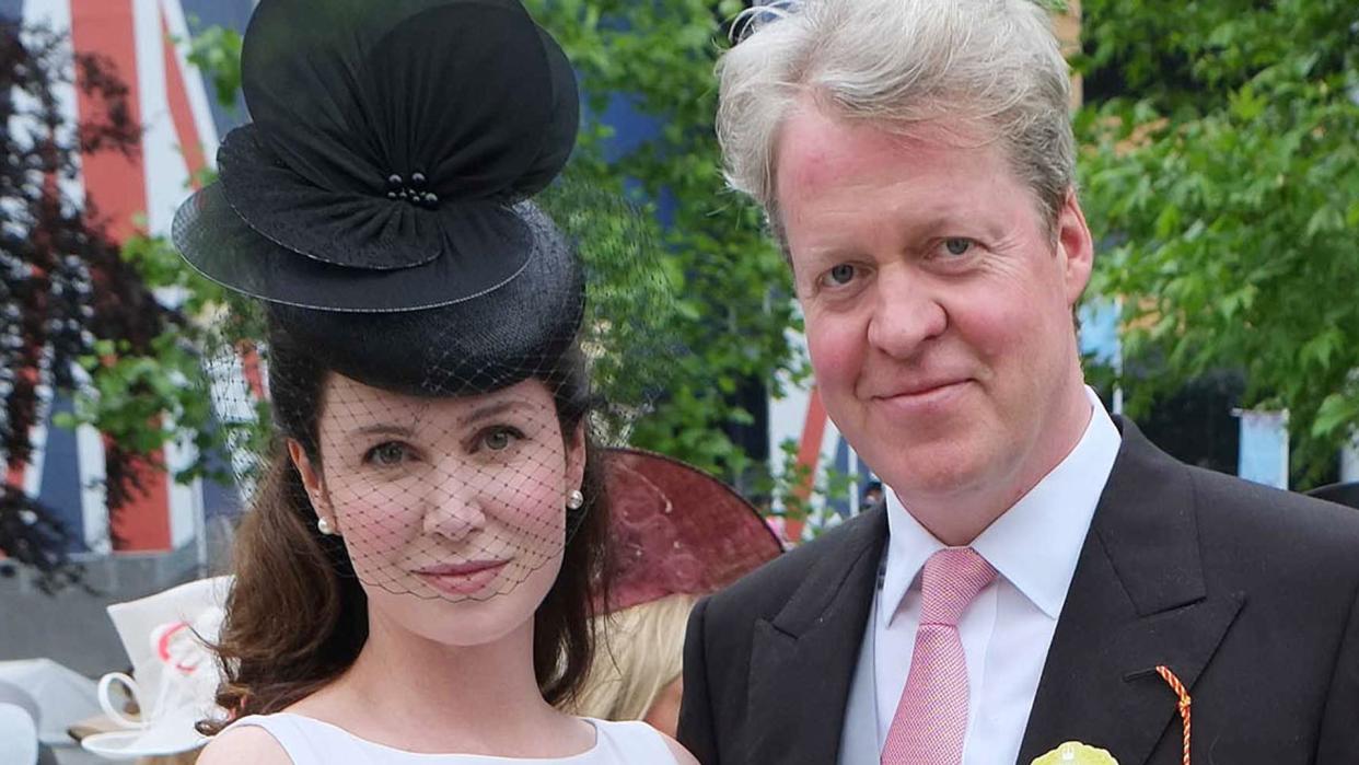 Charles Spencer in a suit with wife Karen in a white dress