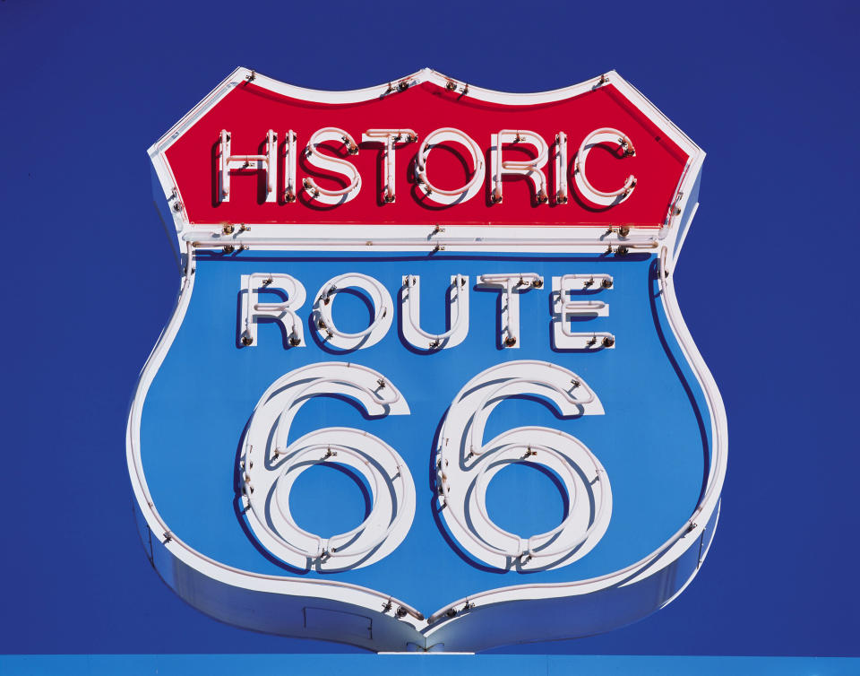 A red white and blue sign that reads Historic Route 66