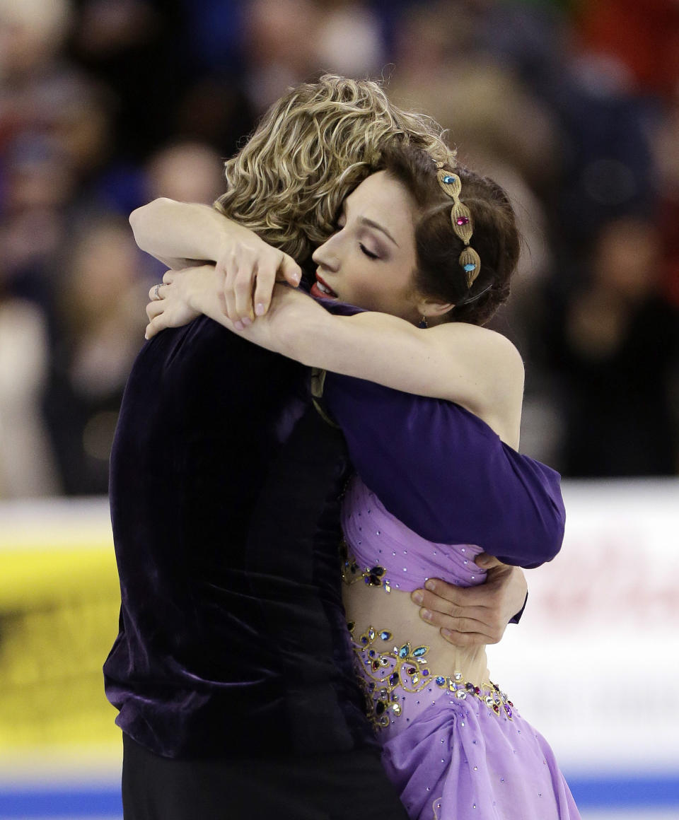 Meryl Davis and Charlie White hug after skating during the ice dance free skate at the U.S. Figure Skating Championships Saturday, Jan. 11, 2014 in Boston. (AP Photo/Steven Senne)