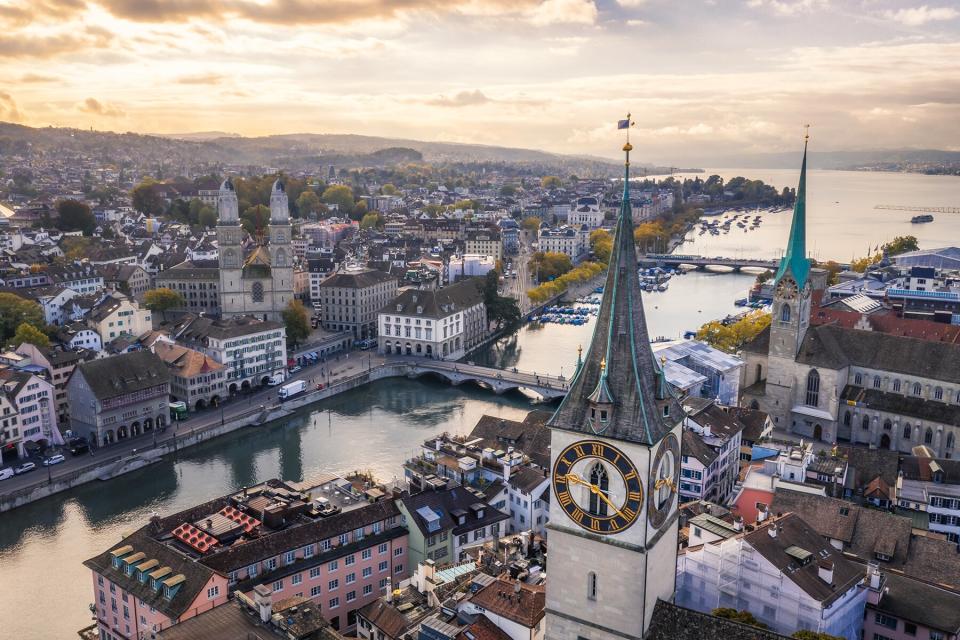 aerial view of St. Peter's Church clock tower, Fraumunster and Grossmunster by the Limmat River, Zurich old town at morning