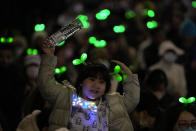 A young supporter of Taiwan People's Party (TPP) cheer during a rally in Taipei, Taiwan on Thursday, Jan. 11, 2024 ahead of the presidential election on Saturday. (AP Photo/Ng Han Guan)