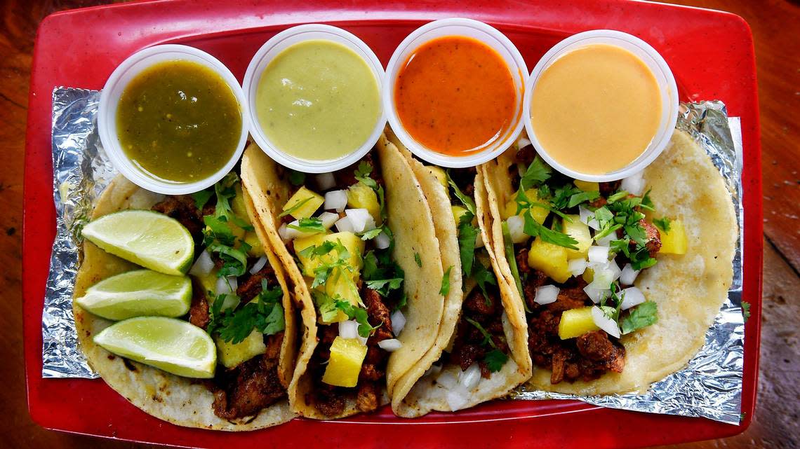 At Carniceria y Tortilleria San Antonio, in the Armourdale neighborhood of Kansas City, Kansas, it is on the customers to dress their ideal street taco. Chopped onions, cilantro, limes, pico de gallo and four different salsas await at the self-service taco bar.