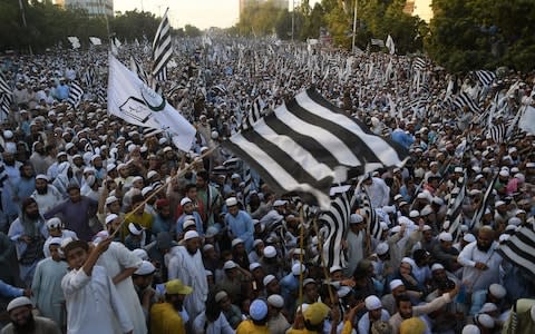 Supporters of the Pakistani religious Islamist group Mutahida Majlis-e-Amal (MMA) gather during a protest rally against the release of Asia Bibi - Credit: Asif Hassan/AFP