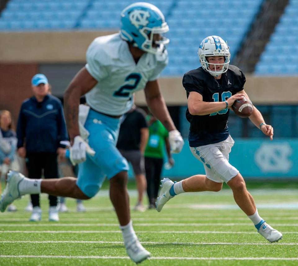 North Carolina quarterback Drake Maye (10) runs the ball during a scrimmage at the Tar Heels’ open practice on Saturday, March 25, 2023 at Kenan Stadium in Chapel Hill. N.C.