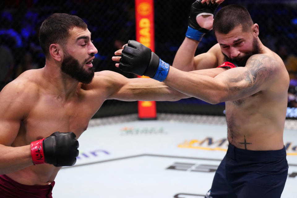 LAS VEGAS, NEVADA – AUGUST 15: (L-R) Ibo Aslan of Turkey punches Paulo Renato Junior of Brazil in a light heavyweight fight during Dana White’s Contender Series season seven, week two at UFC APEX on August 15, 2023 in Las Vegas, Nevada. (Photo by Louis Grasse/Zuffa LLC via Getty Images)