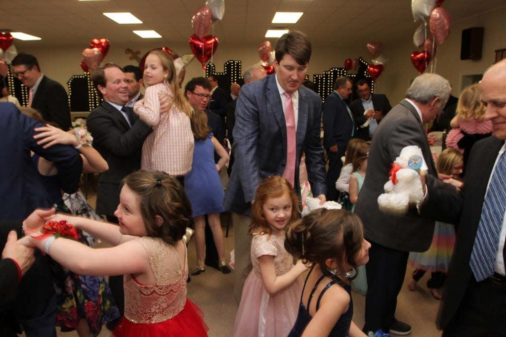 The Craven Literacy Council and Trader Construction Company presented the 9th annual Daddy Daughter Sweetheart Ball at the New Bern Shrine Club in New Bern on Feb. 7, 2020. The fun-filled event is highlighted with an evening dinner, dance, door prizes and silent auction.