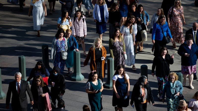 People arrive for the women’s session of the 192nd Annual General Conference at the Conference Center in Salt Lake City on Saturday, April 2, 2022.