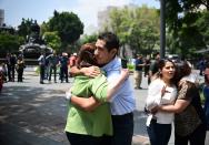 <p>People react as a real quake rattles Mexico City on September 19, 2017 as an earthquake drill was being held in the capital. (Photo: Ronaldo Schemidt/AFP/Getty Images) </p>