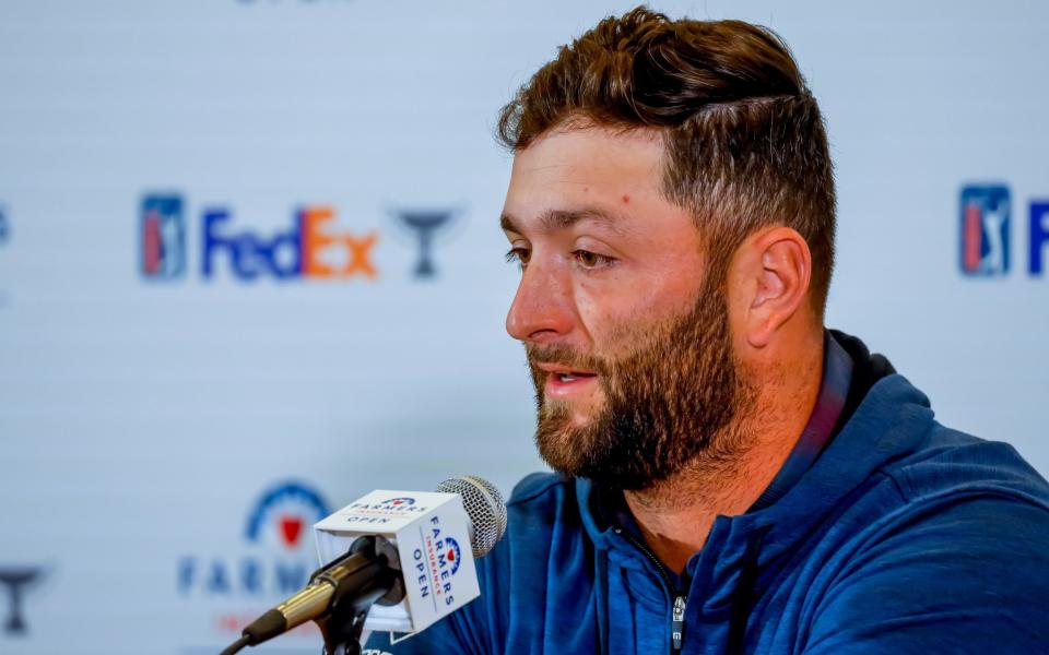 Jon Rahm of Spain speaks to the media before the 2022 Farmers Insurance Open golf tournament at the Torrey Pines Golf Course - Shutterstock