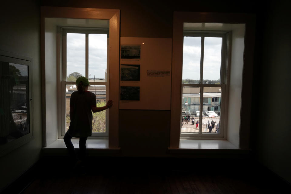 <p>Visitors look at the balcony where MLK was shot at the the Lorraine Motel, now the National Civil Rights Museum, from the view of the gunman, during events surrounding the 50th anniversary of the death of civil rights leader Martin Luther King Jr. in Memphis, Tenn., April 3, 2018. (Photo: Karen Pulfer Focht/Reuters) </p>