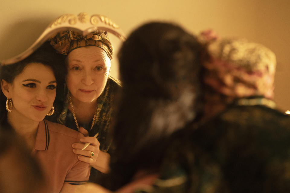 This image released by Focus Features shows Marisa Abela as Amy Winehouse , reflected at left, and Lesley Manville as Cynthia Winehouse, in a scene from "Back to Black." (Focus Features via AP)